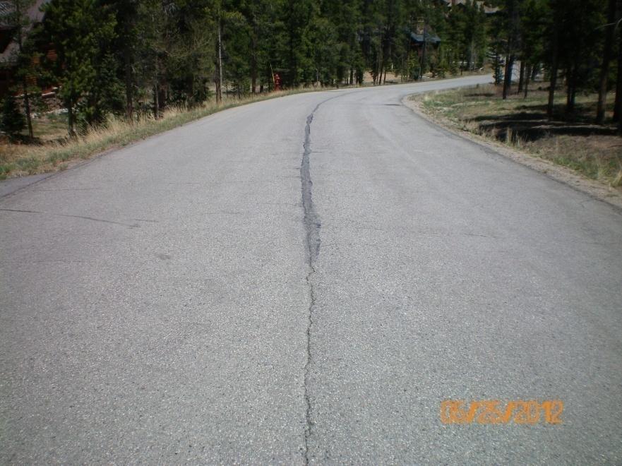 Longitudinal Cracks Cracks running in the direction of traffic are longitudinal cracks.