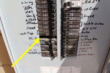 Open breaker panel slot was observed at the main panel box cover.