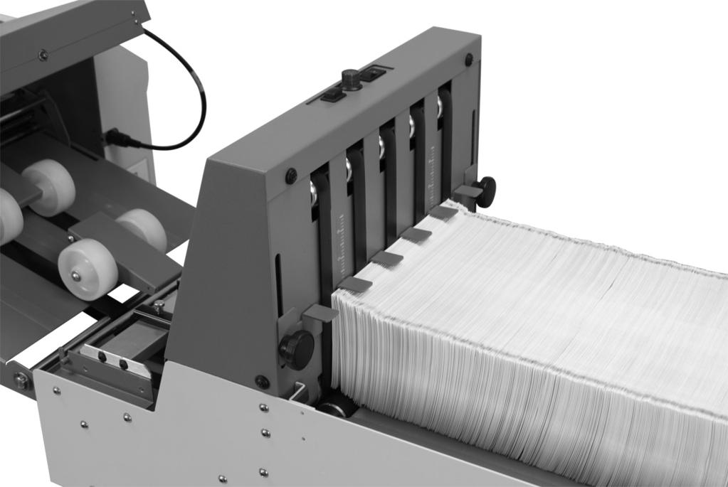 Place the 6-roller-ball deck onto the pins (A) on either side of the stacker infeed and slide into place. 5. Place the crossbar (B) of the guide wheels into the grooves of the stacker infeed. 6. Plug power cord into stacker and appropriate electrical outlet.