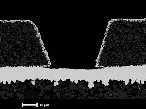Figure 6 shows a typical BMV (60 µm width 40 μm depth) on a standard build-up film as widely used in mass production processed with E less Copper IC a new, vertical electroless copper bath developed