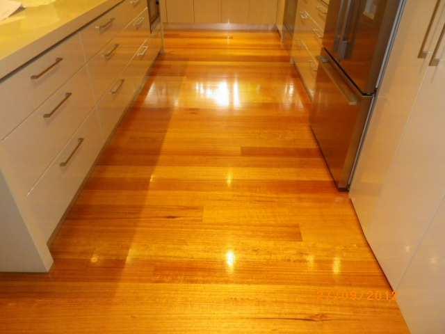 2) Small dents in the timber flooring in