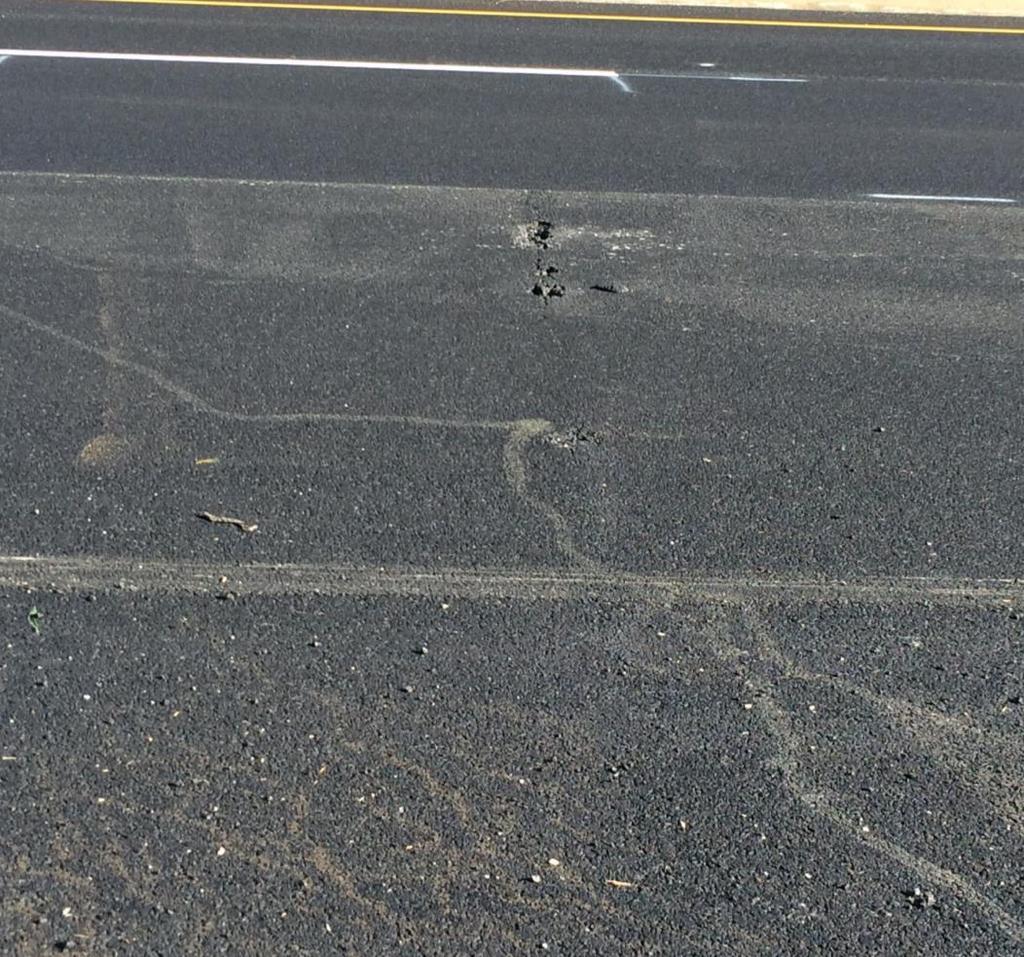 Reflective crack and spall, with 2 weeks of traffic Pavement cracks or joints ¼ inch or more in width shall be cleaned and filled with a sealant material conforming to the Special Provision For