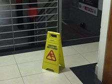 Are signs posted to warn of wet floors? Signage exists in the facility but wasn't used in this instance.