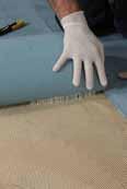 Multi-purpose adhesive in water dispersion for laying vinyl flooring and walls and for bonding textile flooring and walls with