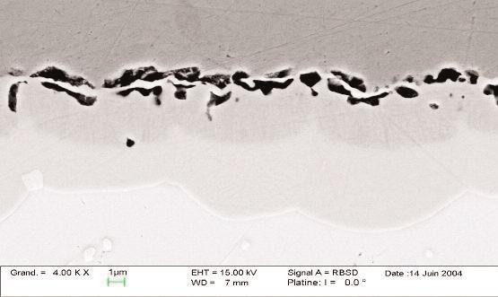 Figure 1: Interface between Sn-Ag-Cu solder ball and Cu pad after 1000 hours at 150oC. Kirkendall voiding is, typically, found within the Cu3Sn phase at the Cu - Cu3Sn interface.