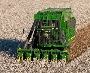 producing an 8 ft. x 8 ft. x 16 ft. module of cotton (Case-IH). The John Deere 7760 is a 530 horsepower machine which forms harvested cotton into round bales wrapped with plastic.