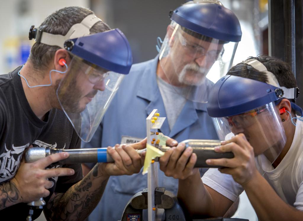 PHOTO CREDIT: BOB FERGUSON Instructor Brian Wilson helps to develop a skilled manufacturing workforce.