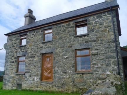 CONWAY, NORTH WALES Secluded Smallholding in an elevated location with far reaching views, comprising a four bedroom brick farmhouse, steel frame multipurpose building and approximately 12 Acres of