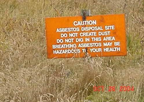 Asbestos waste is isolated, warning signs are