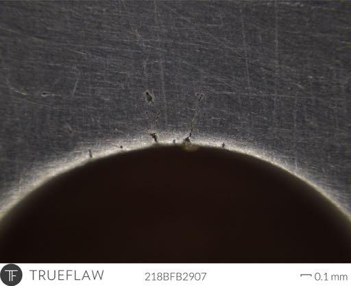 Figure 3. Microscopic image of typical crack in aluminum. The manufactured cracks were first inspected using fluorescent dye penetrant (FPI) at Trueflaw.