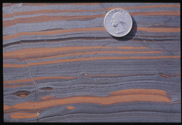 An iron range is an elongate belt of layered sedimentary rocks in which one or more layers consist of banded iron-formation, a rock