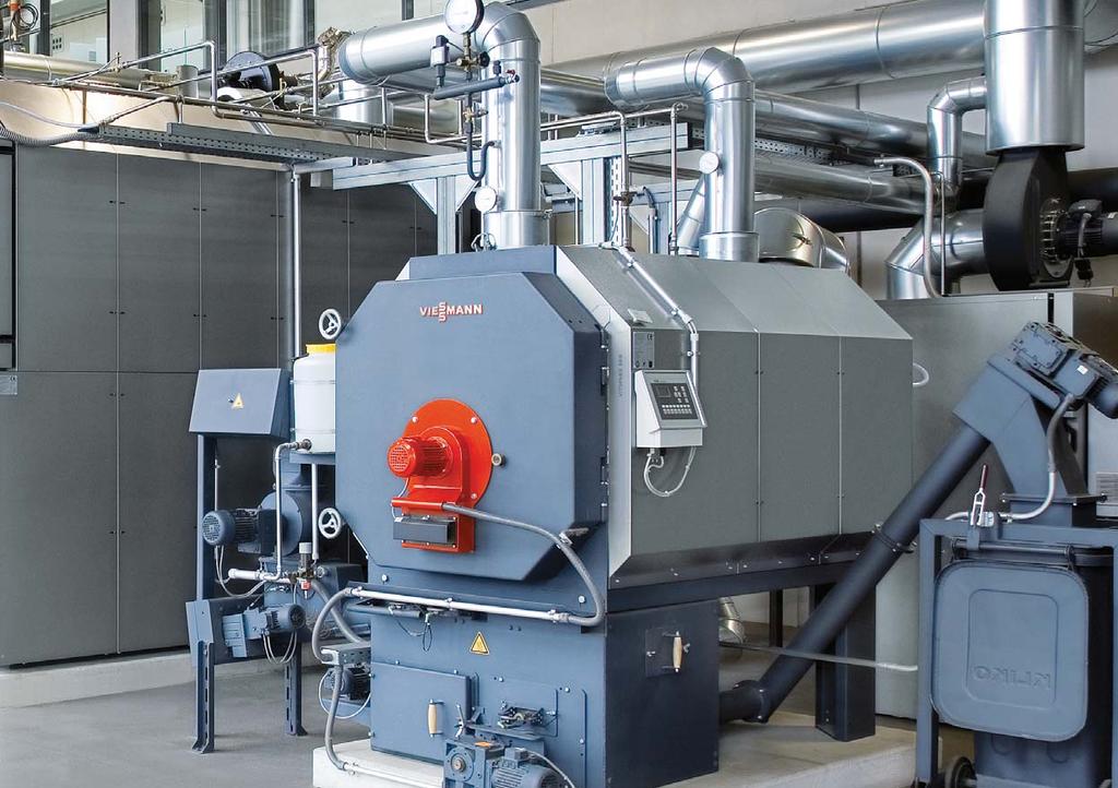 12/13 The energy centre at Viessmann Allendorf: Two biomass boilers on the right; two CHP units alongside Two CHP units operated with bionatural gas cover the base heat load and simultaneously
