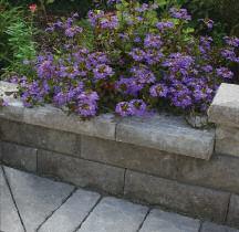 Premium blended colors enhance the hand-hewn look of the Arazzo Retaining Wall System.
