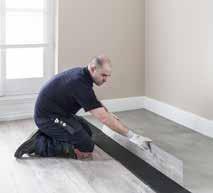 7. Pull back the rows of panels and apply glue to the floor using an A2 trowel.