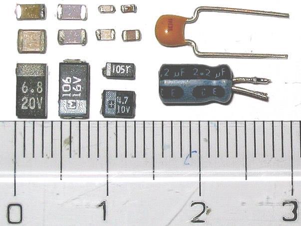 Capacitor packages 38 SMD: ceramic at top left; SMD tantalum at bottom left; Through-hole: