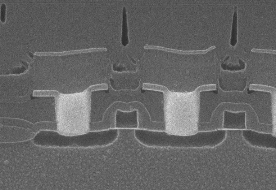 13. SEM section views of metal 1 contacts
