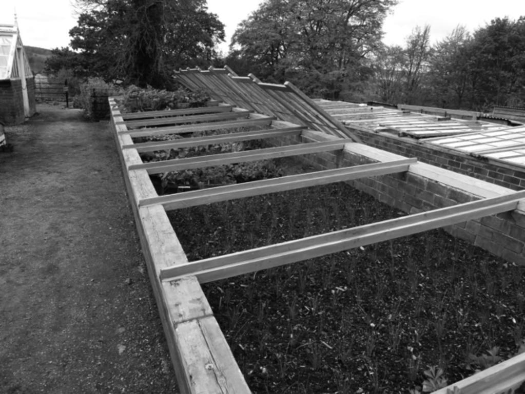 4 The photograph shows a row of cold frames.