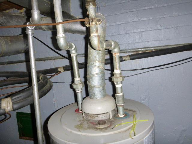 Plumbing pictures Galvanized steel water pipes Improper drum trap Leaky, corroded