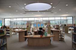 The daylighting strategy at the media center and cafeteria employs clerestories, but not light shelves. Consequently, daylight surrounds and engulfs these spaces.