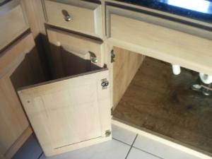 INTERIOR INSPECTABLE ITEMS Cabinets: REPAIR or REPLACE - Loose sections are present.
