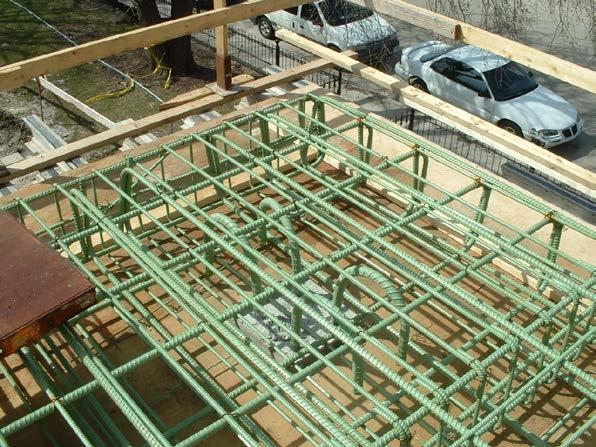 Photo 5 shows epoxy-coated rebar that has been assembled to join a column with a structural concrete deck that will be exposed to the weather.