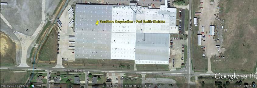 Vacant area left of white cylinders is where process wastewater is stored before