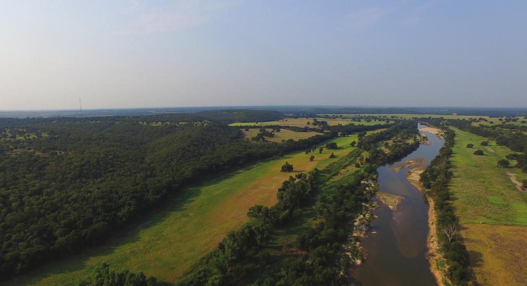 Rocking W Ranch Millsap, Texas Approximately 1 hour west of DFW International Airport Interstate Frontage Full professional equine facilities Brazos River frontage with significant water rights