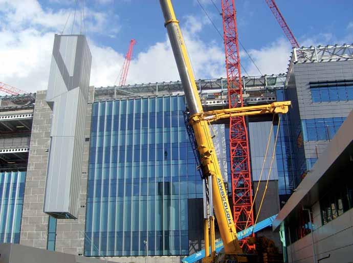 Unitised curtain wall facade, prefabricated chimneys and rainscreen cladding The main envelope installation was achieved without scaffolding by using a prefabricated and pre-glazed unitised form of