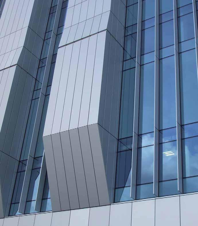 Unitised Facade and Chimneys to Office Areas The main envelope is comprised of prefabricated and pre-glazed curtain wall elements with a natural anodised finish.