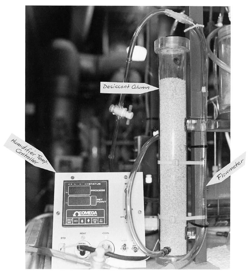 FIG. 3 Detail of Desiccant Column and Flowmeter 11.1.4 Re-weigh the humidity cell, and record the resulting tare to the nearest 0.1 g; the original cell tare (11.1.2) minus the new cell tare is the weight of the filter media.