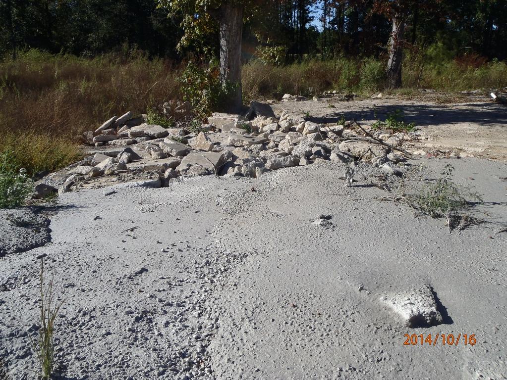 Description: the South West edge of the property and off the property 15:36 Photographer: Clark Baker Date: 10/16/2014 Time: 8 Witness: None Photo #: