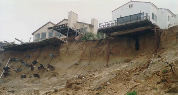 The continuous loss of the protective beach strand results in direct wave attack at the toe of the bluffs, episodically triggering upper bluff collapses and shoreline retreat.