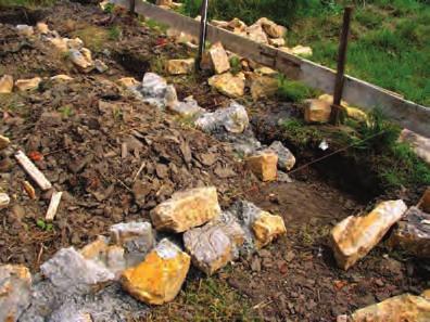 Rock Foundation trench is too shallow Not enough concrete between rocks Bottom rock layer not embedded Rock layer of foundation is not embedded in concrete How can I do it better?