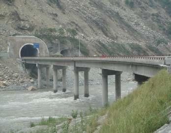 Fig. 2 Overview of Duxiufeng Bridge after the earthquake a TRD at left side of abutment 0 b. TRD at right side at bent 3 Fig.