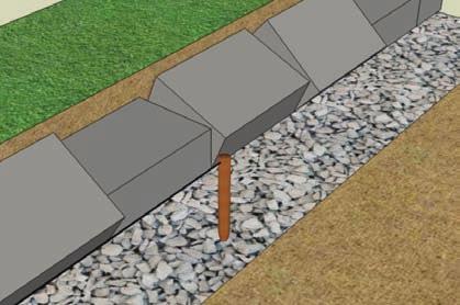 Place the second unit of the step up on the last unit of the first course, 1/2 on that unit and 1/2 on the stepped up leveling pad.