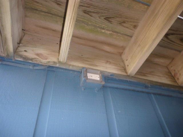 1. There are several areas of soft, deteriorated wood present on the wood siding and trim located throughout the exterior. See Photos.