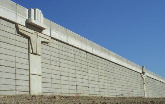 The MSE retaining walls, supplied by Tricon Precast in Houston, feature a special decorative coping that ties into the design theme.