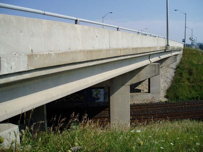 lanes of travel in each direction plus sidewalks on both sides (See Figure 9-11). This bridge is planned to be widened to six lanes in 2005.