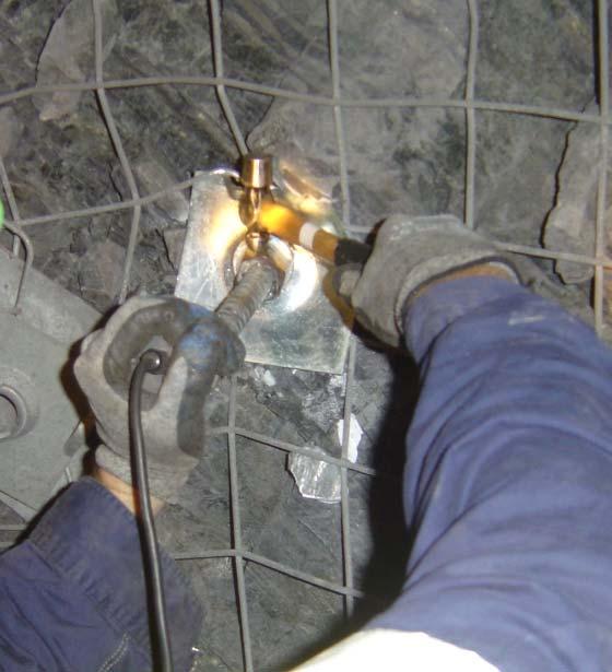 Figure 3 - Photo showing transducer (vertical) held at the end of bolt (i.e. collar of hole) at Mandalong Coal Mine 4.