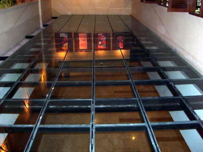 Glass flooring Glass is a brittle material and surface damage can occur by impact from hard objects.