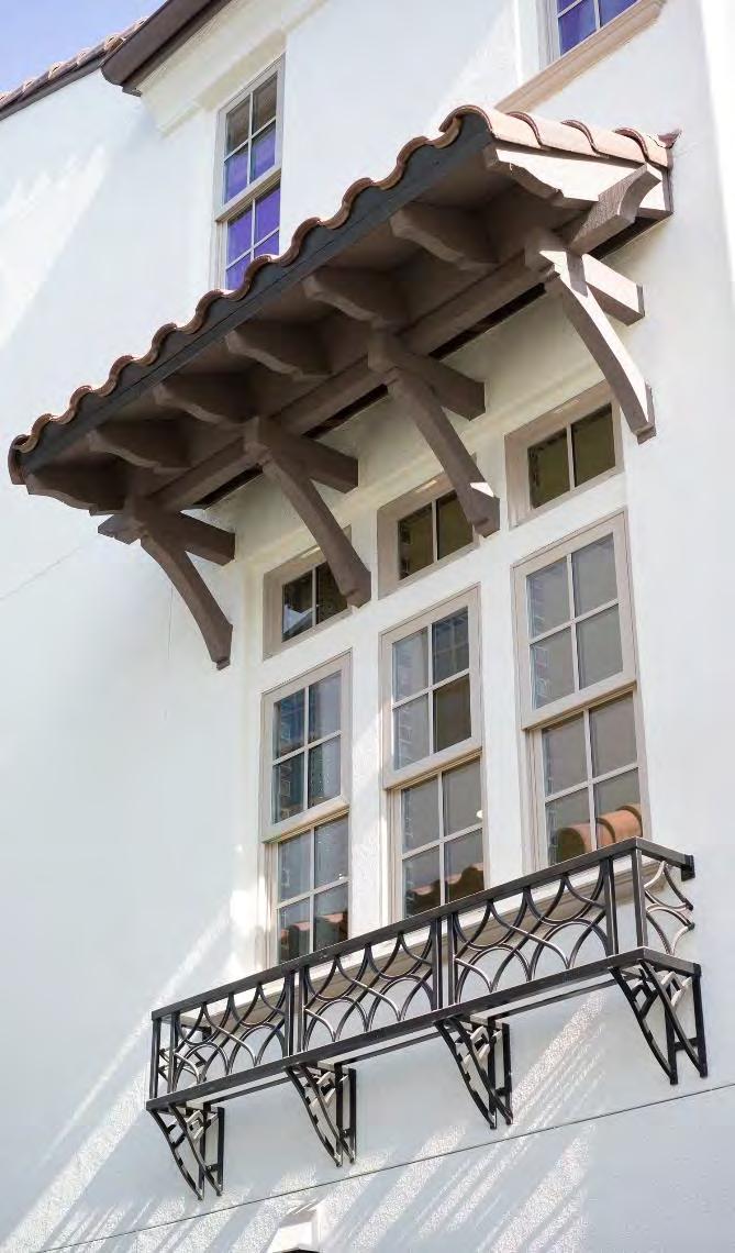 Figure 14.09.52: Example of incorporating window awnings to enhance the architecture of the building. Figure 14.09.51: Example of incorporating window details to enhance a flat façade.