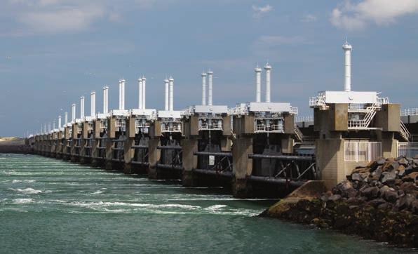 Water from high tides can be trapped in reservoirs behind dams like the one below. When the tide drops, the water can be let out through a turbine to generate electricity. WAVE ENERGY.