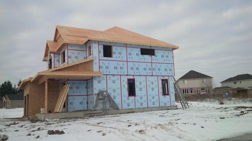 Extruded Polystyrene (XPS) insulated used as continuous insulated sheathing for a house.