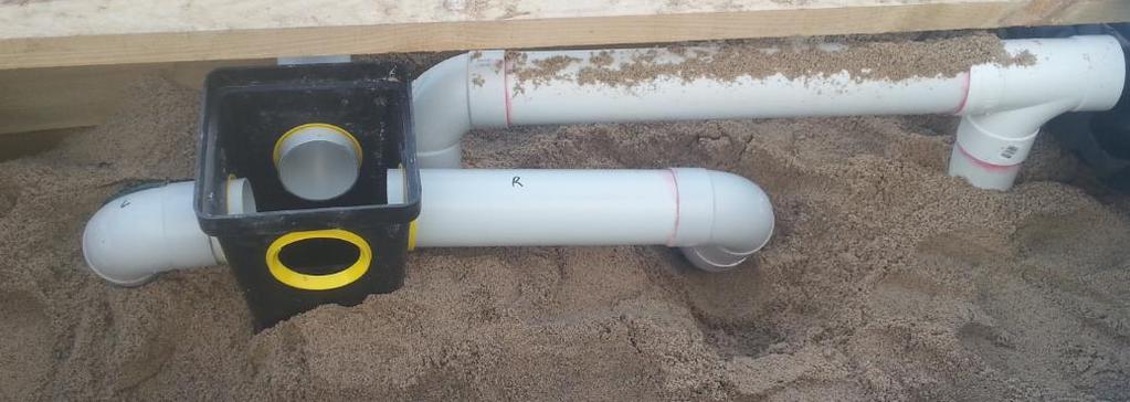The hole with the yellow seal visible is the inlet port. The other pipework in the photo is the high vent manifold connecting rows 2 and 4. Photo 3.