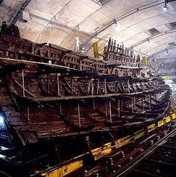 20 The Mary Rose was a wooden warship. The Mary Rose sank in 545 but was lifted from the sea bed in 982. Scientists are now preserving the ship. The image shows the Mary Rose being supported on poles.