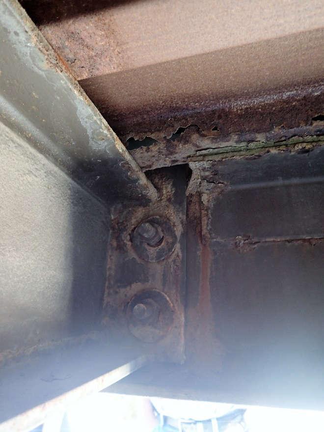 overhang of high roof, close-up of typical bolted connection of fascia member to