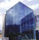 profiles, with glass panels structurally silicone bonded to aluminium retaining profiles.