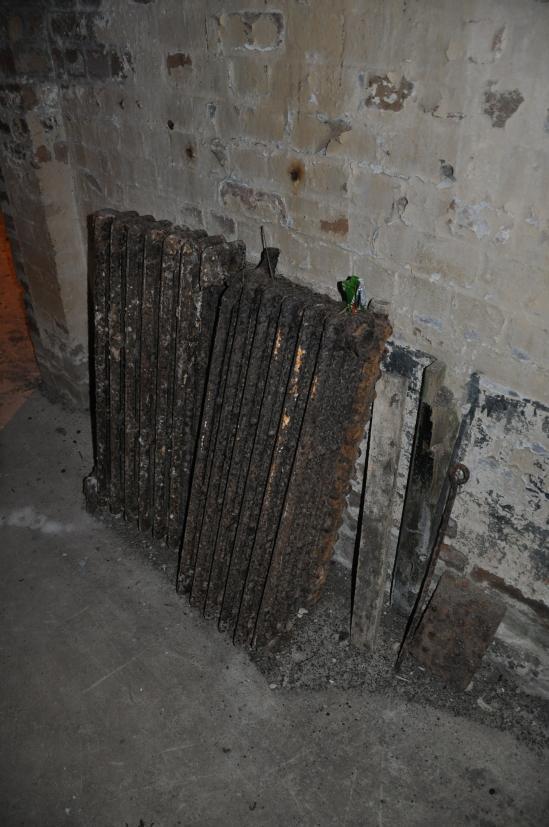 1.7.5 Heating Remains of existing solid-fuel boiler in plant room. Former hospital pattern radiators generally no longer present. Those that remain are not in usable condition.
