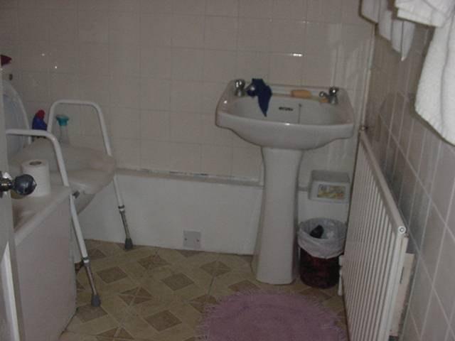 Rear Right Hand Bathroom Ceilings: Painted Hairline cracking visible Tiled to about one and a half metres and painted above that Ingrained dirt and messy grouting Re-grout, repair, prepare and