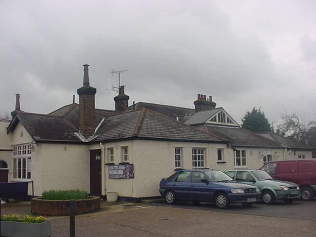 RIGHT HAND SIDE ELEVATION Chimneys: Three chimneys (front, middle, right) Fourth chimney: large brick chimney with four chimney pots and one flue to rear Roofs: Natural slate roof Roof window Two